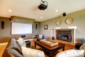 Living room with a projector and a fireplace